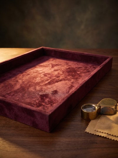 The Jeweller's Counter — Warm counter light pooling on velvet.