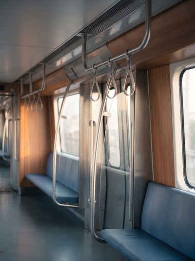 The Commute — Flat even carriage light, one bright rail across the frame.